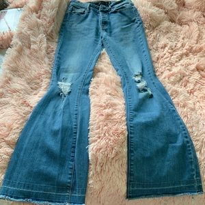 Distressed flared jeans